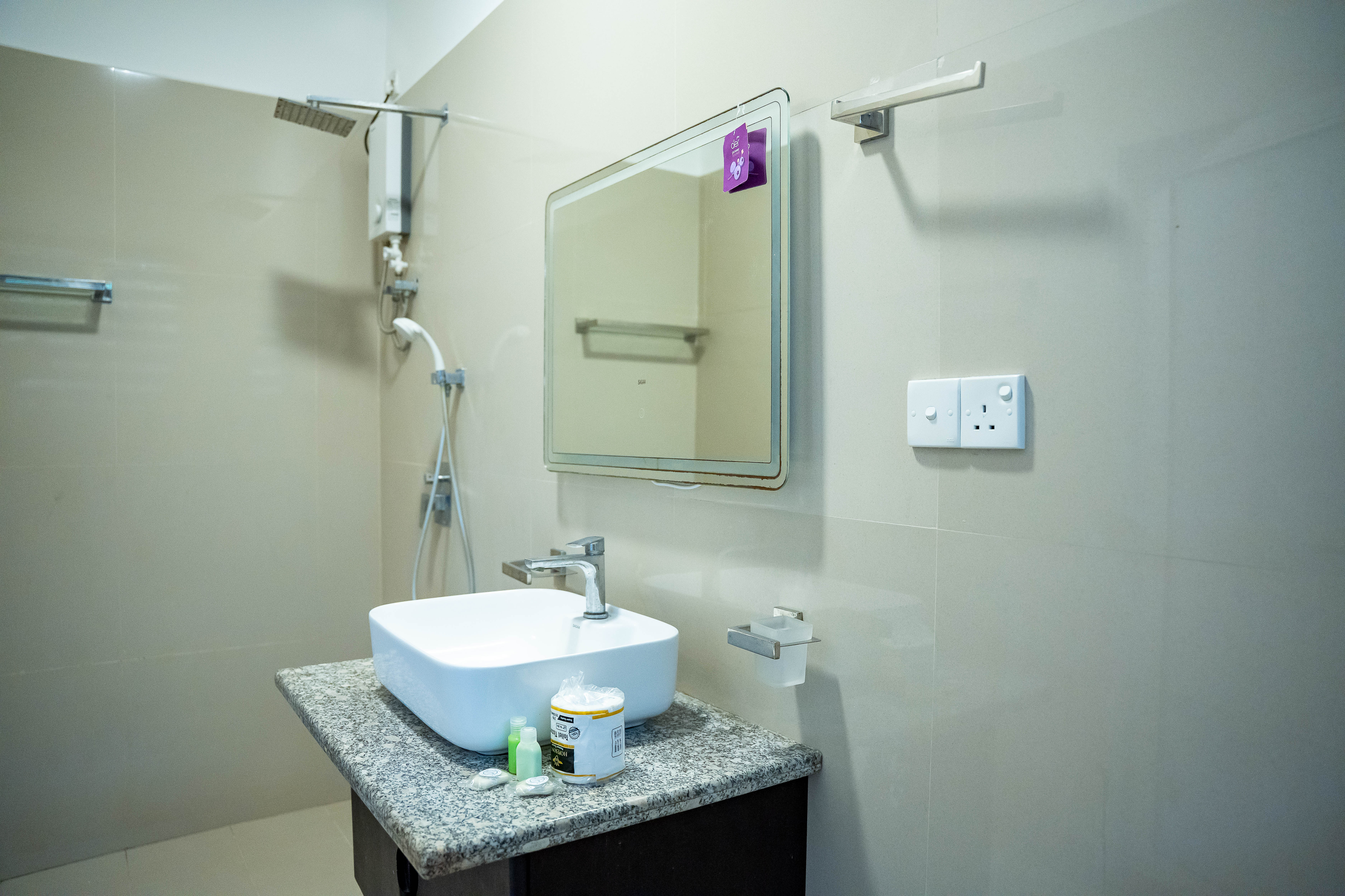 Luxury bathroom with granite counter and backlight mirror