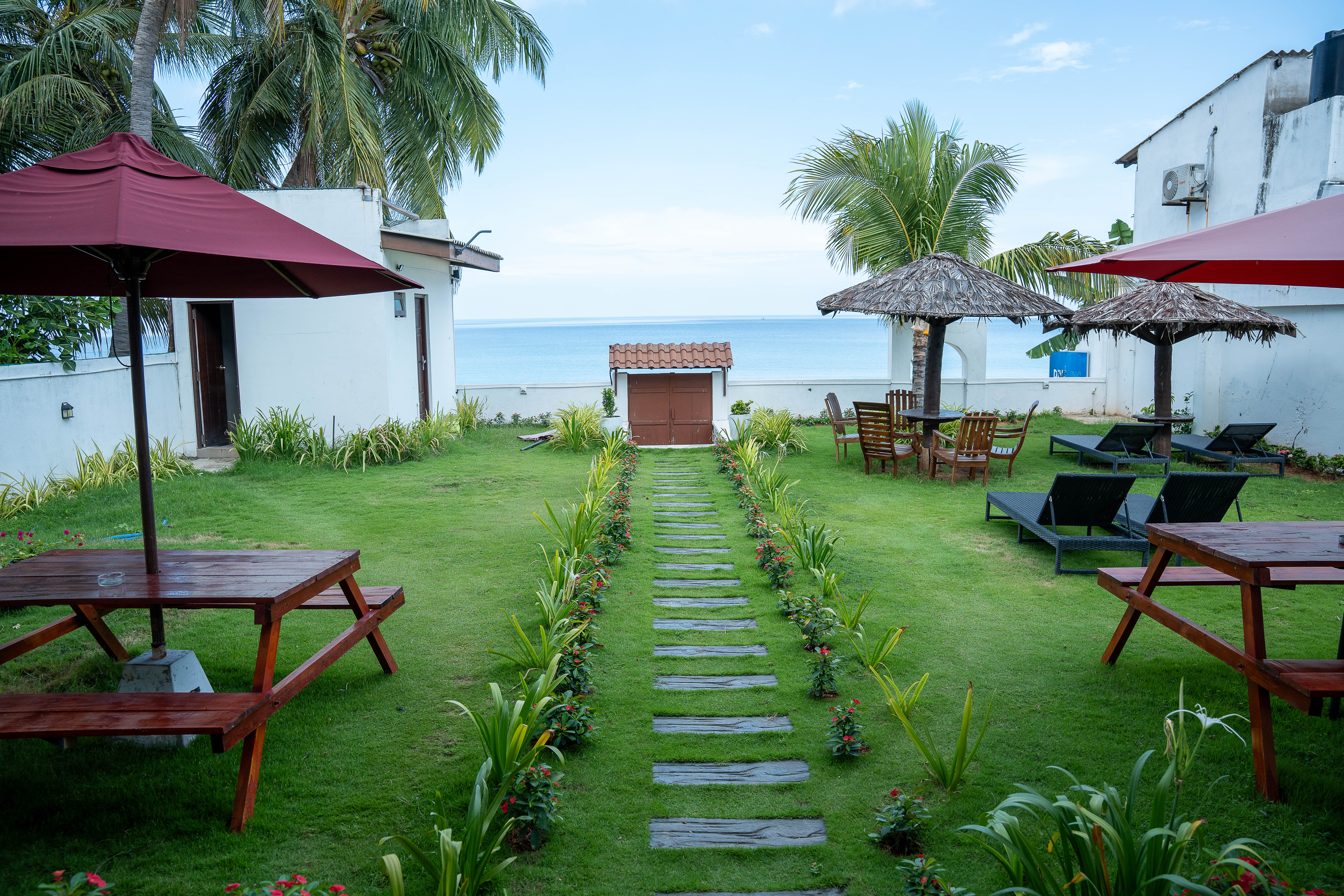 Outdoor dining benches overlooking Dutch Bay sea